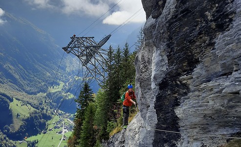 Hiking a via ferrata route in the mountains